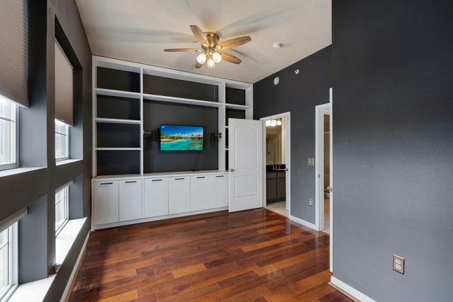 Secondary bedroom with built in bookshelves | Image 11
