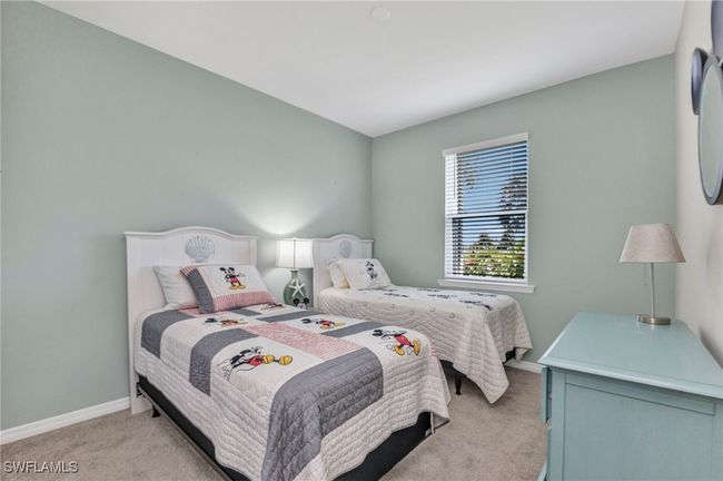 Bedroom with light carpet and baseboards | Image 29