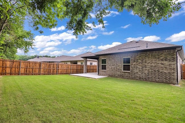Fenced backyard featuring a patio | Image 28