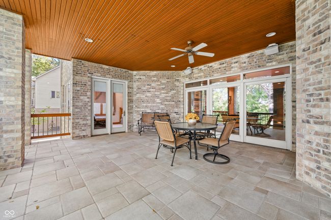 view of patio / terrace with a ceiling fan and outdoor dining space | Image 105