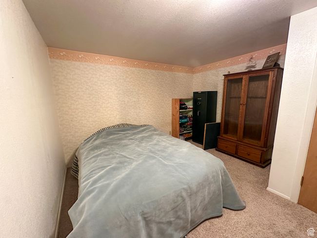 Bedroom featuring carpet | Image 22