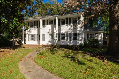 View of front facade with a front lawn | Image 1