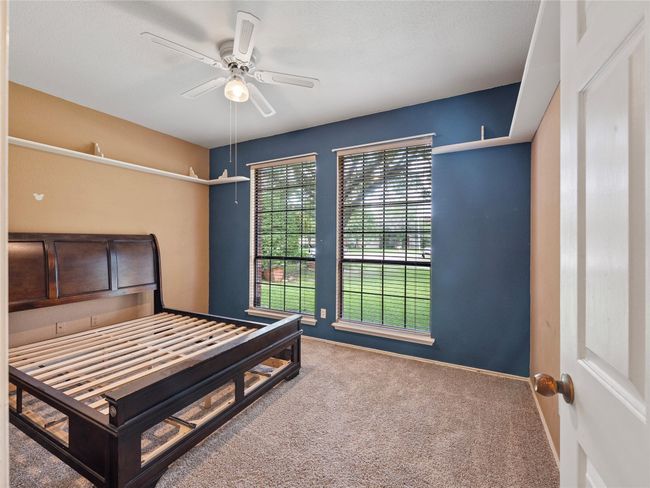 Carpeted bedroom featuring baseboards and ceiling fan | Image 19