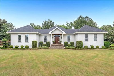 Ranch-style home with a front yard | Image 1