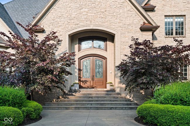 doorway to property featuring french doors and stone siding | Image 4
