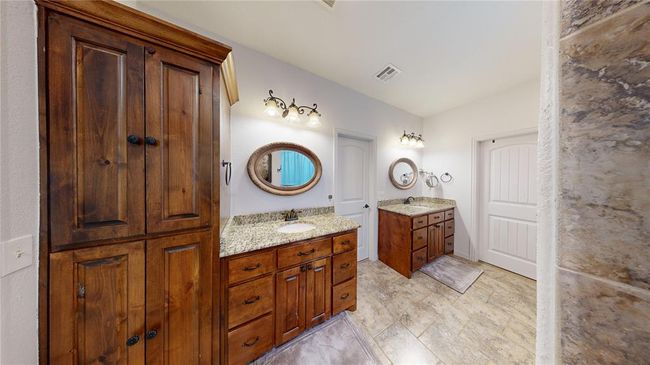 Full bathroom featuring two vanities, visible vents, and a sink | Image 33