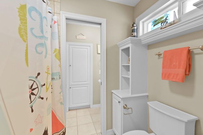 The Jack-and-Jill bathrooms feature separate sinks and convenient pocket doors for added privacy. | Image 33
