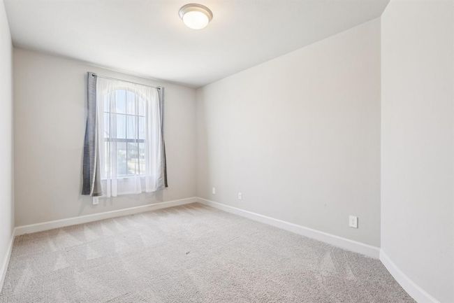 Upstairs bedroom 3 with ample space and closet storage—perfect for kids or a home gym | Image 32