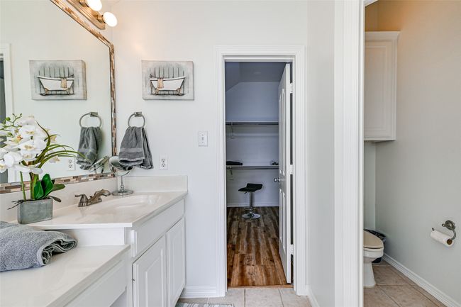 Bathroom with hardwood / wood-style floors, oversized vanity, and toilet | Image 16