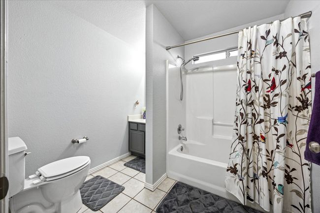 Secondary bath with a tub/shower combo, conveniently located near the secondary bedrooms for easy access. | Image 22