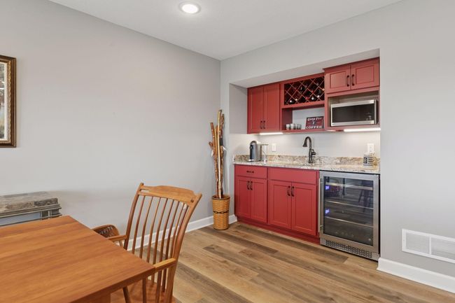 Full wet bar with granite tops, wine/beverage cooler and microwave | Image 42