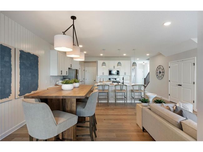 Conveniently located off the kitchen we find the dining room! Perfectly sized to accommodate any table or set up you could want! Photo of model home. | Image 29