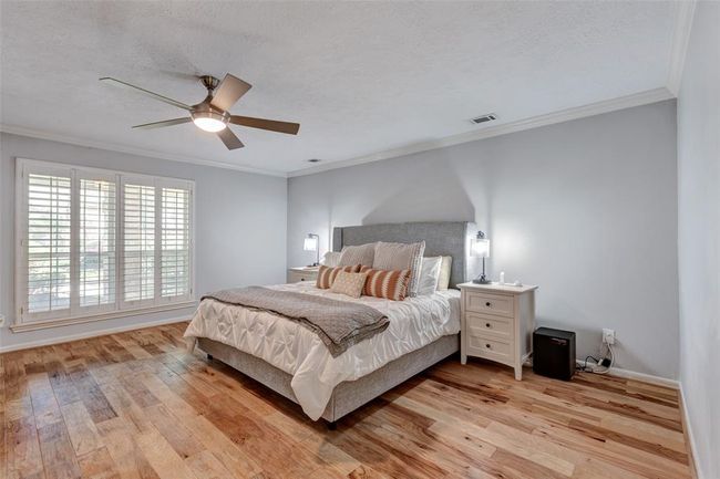 Primary Bedroom with plantation Shutters | Image 24