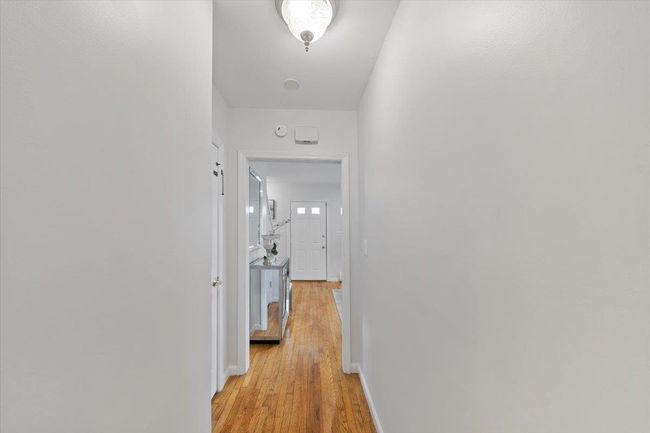 Corridor with baseboards and light wood finished floors | Image 28