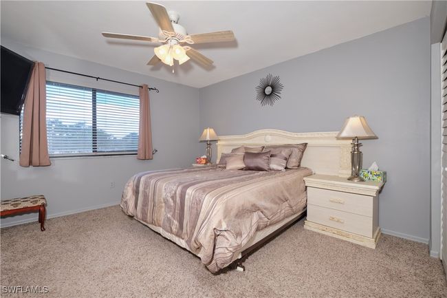 Carpeted bedroom featuring baseboards and ceiling fan | Image 18