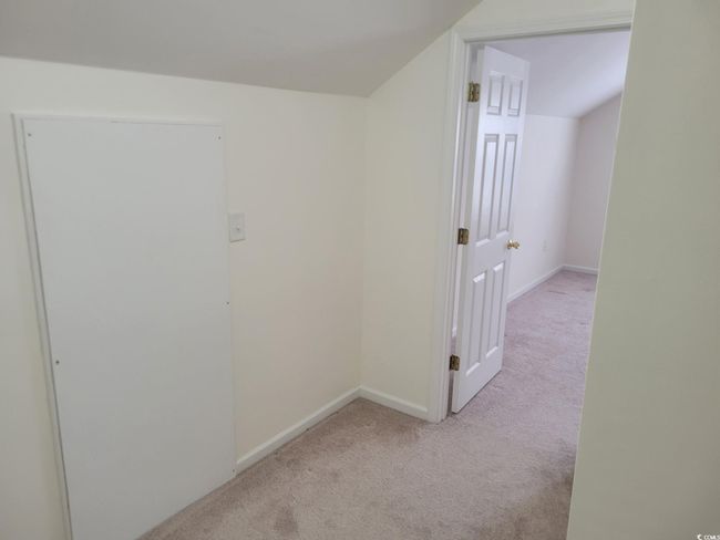 Hallway featuring carpet and baseboards | Image 29