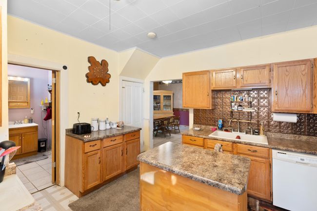 Kitchen with Center island and addiontional counter and cupboard space | Image 5