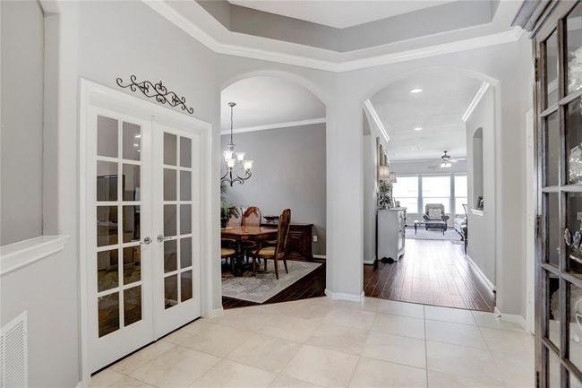 An alternative view of the end of the entry hallway displays the home's excellent flow and abundant light. | Image 9