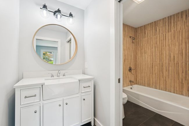 2nd fl Bathroom with tile patterned flooring, vanity, and bathtub / shower combination | Image 16
