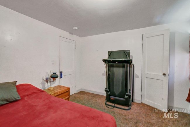 Carpeted bedroom featuring baseboards | Image 26