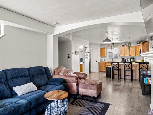 Living room featuring light wood-type flooring | Image 6