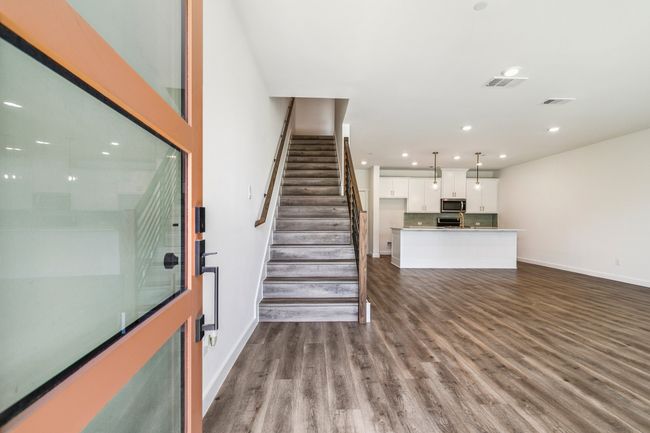 Stairway with wood finished floors, baseboards, and recessed lighting | Image 5