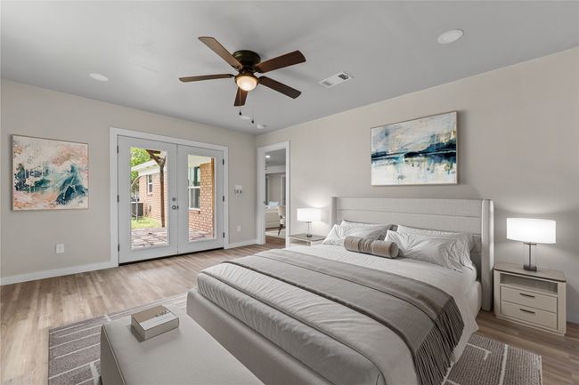 Bedroom featuring access to outside, wood finished floors, french doors, baseboards, and a ceiling fan | Image 7