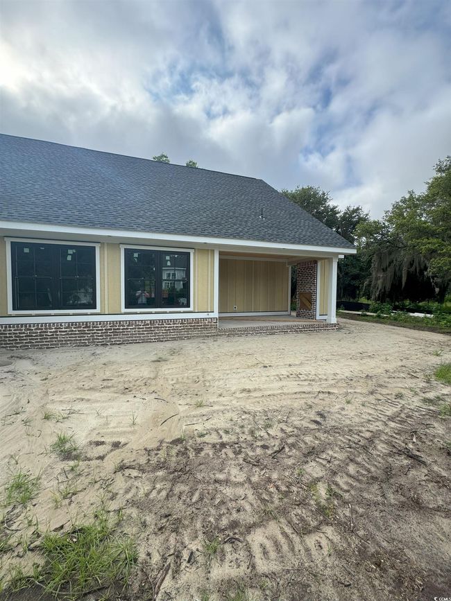 Back of property with brick siding and roof with shingles | Image 8
