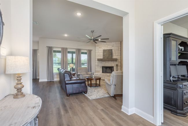 Windows across the back wall showcase your expansive lot and views. | Image 5