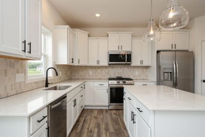 (*Photo of similar home, actual homes colors and finishes will vary) Alternate view of kitchen | Image 2