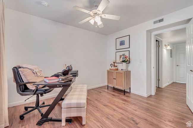 Office area featuring ceiling fan, light wood-style floors, and baseboards | Image 13