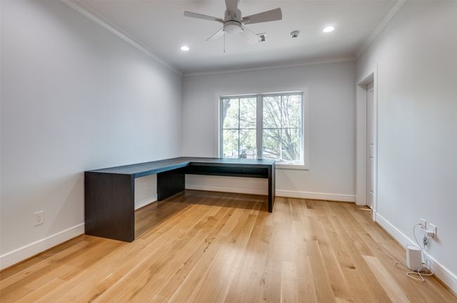 Unfurnished office featuring ornamental molding, baseboards, ceiling fan, and light wood-type flooring | Image 20