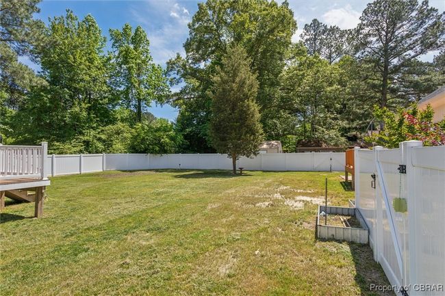 View of yard featuring a deck | Image 31