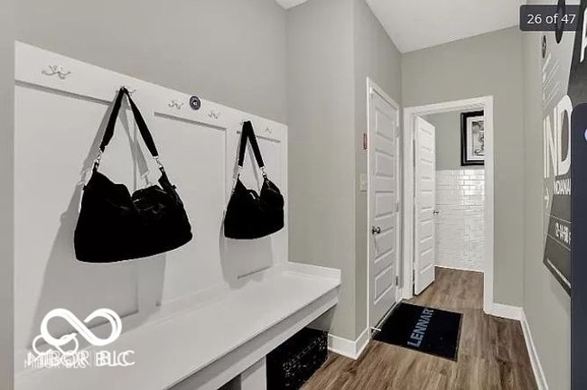 Mudroom featuring vinyl wood-style flooring and baseboards | Image 24