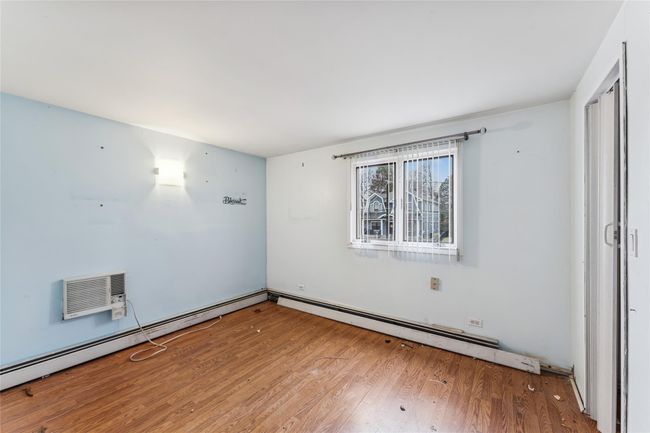Unfurnished room featuring wood finished floors | Image 10