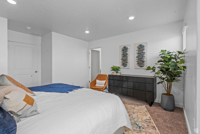 Bedroom with carpet flooring and recessed lighting | Image 15