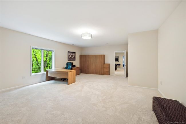 Lower level bedroom currently used as an office. | Image 32
