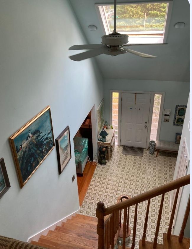 Stairs with baseboards and wood finished floors | Image 35
