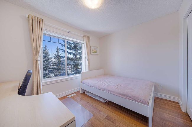 84 Bridleridge Manor Sw, Home with 3 bedrooms, 2 bathrooms and 1 parking in Calgary AB | Image 23