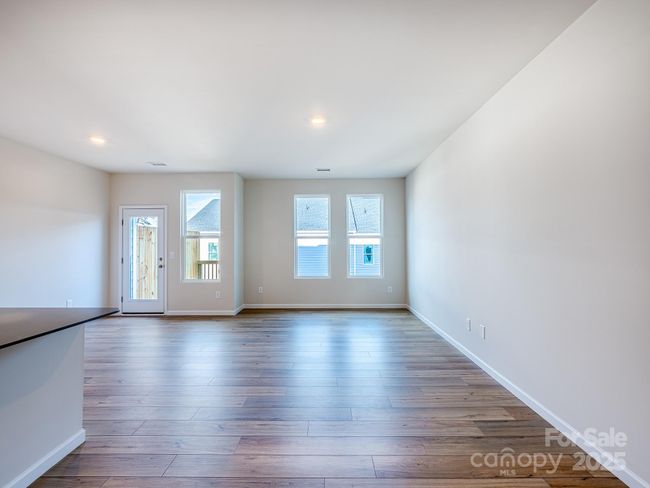 Spacious and open floor plan with large windows for natural light - Photo is representational | Image 11