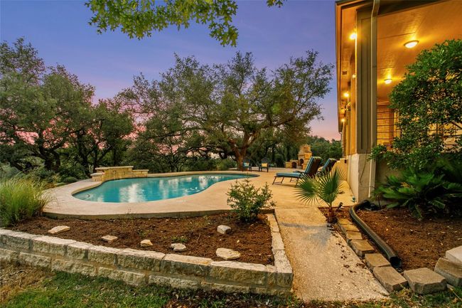 Pool at dusk featuring a patio and an outdoor pool | Image 39