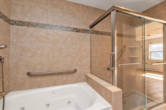 Bathroom featuring a jetted tub and a shower stall | Image 18