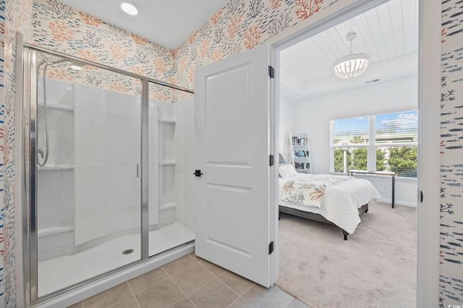 Ensuite bathroom with tile patterned flooring, a stall shower, ensuite bathroom, and wallpapered walls | Image 24