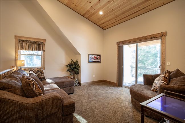 Upper level living room with deck access | Image 116