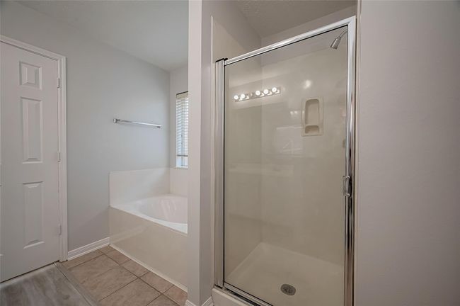 Shower and soaker tub located in the primary bathroom | Image 23