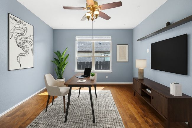 Home office featuring a ceiling fan and wood finished floors | Image 6