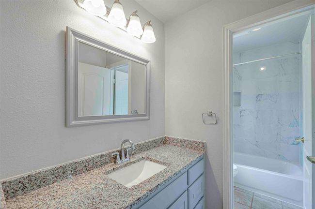 Full bathroom featuring shower / bathing tub combination, toilet, and vanity | Image 21