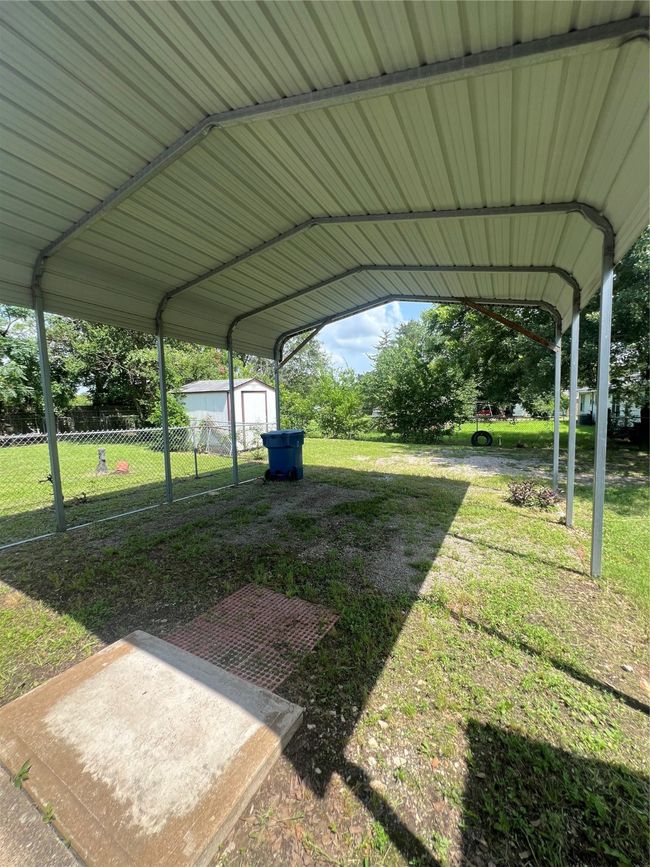 View of yard with a shed and a carport | Image 26