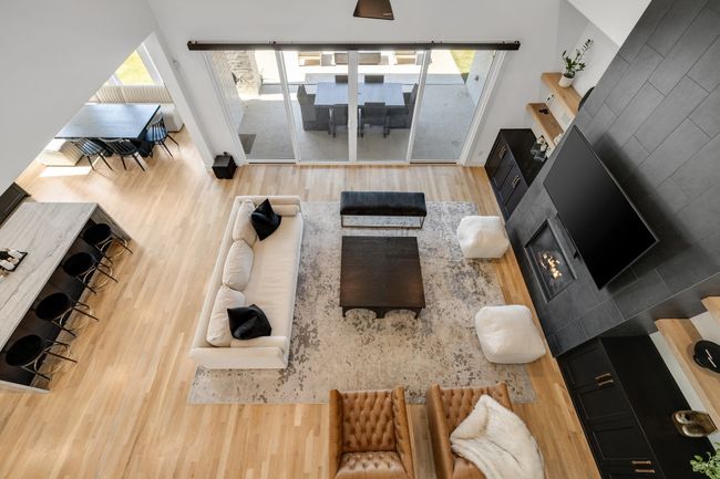 Living room with wood finished floors, plenty of natural light, and baseboards | Image 27