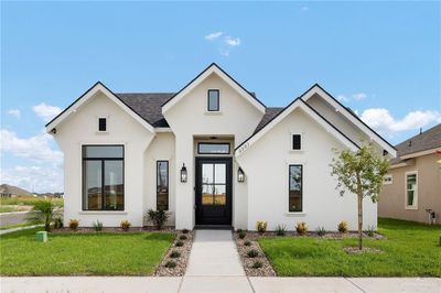 Modern farmhouse style home featuring a front lawn | Image 3